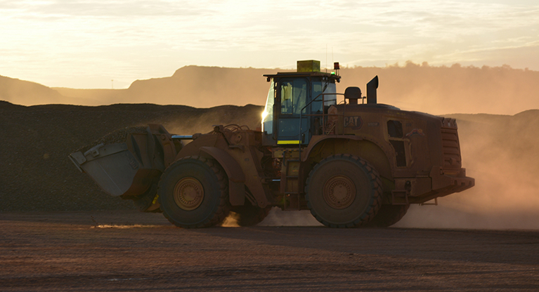 Wheel loader operating at a mine site as part of mine stemming services